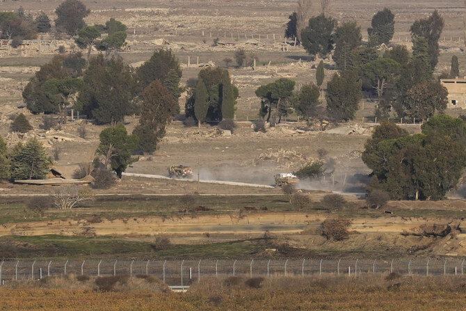 Israeli armored vehicles maneuver on the Syrian side of the Quneitra crossing, between Israel and Syria, are viewed from the Israeli-annexed Golan Heights, Monday, Dec. 9, 2024. (AP)