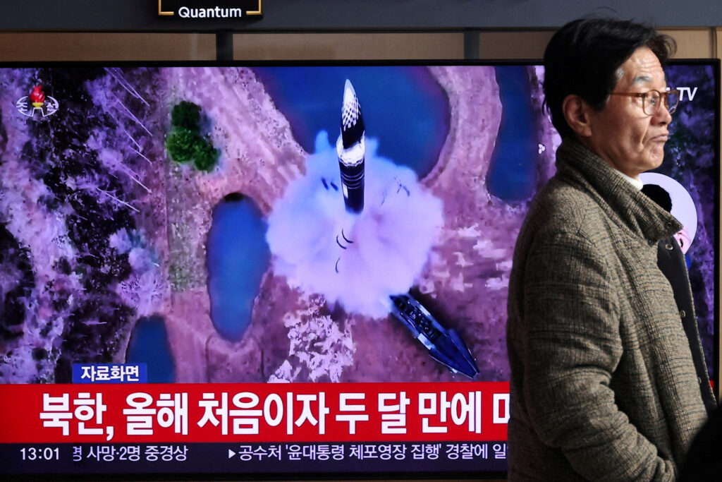 A man walks past a TV broadcasting a news report on North Korea firing a ballistic missile out to sea off its east coast, in Seoul, South Korea, January 6, 2025. (REUTERS)