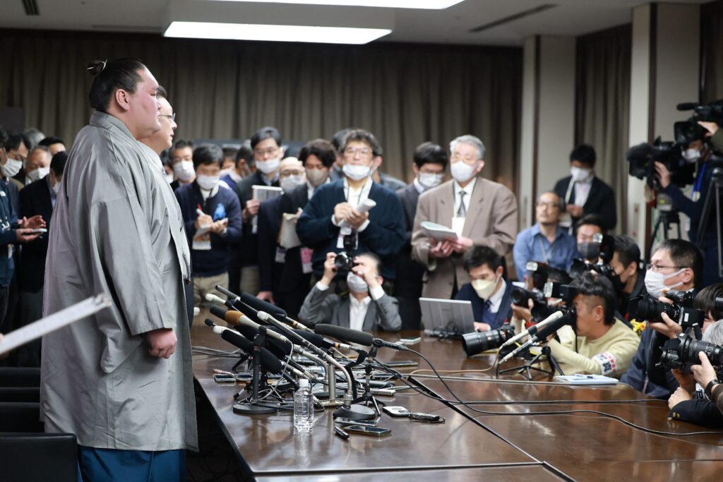 Mongolian-born grand champion Terunofuji (L) holds his retirement press conference in Tokyo on January 17, 2025. Sumo grand master Terunofuji announced his retirement on January 17, potentially leaving the ancient Japanese sport without a wrestler at the highest rank of yokozuna for the first time in over 30 years. (Photo by JIJI Press / AFP