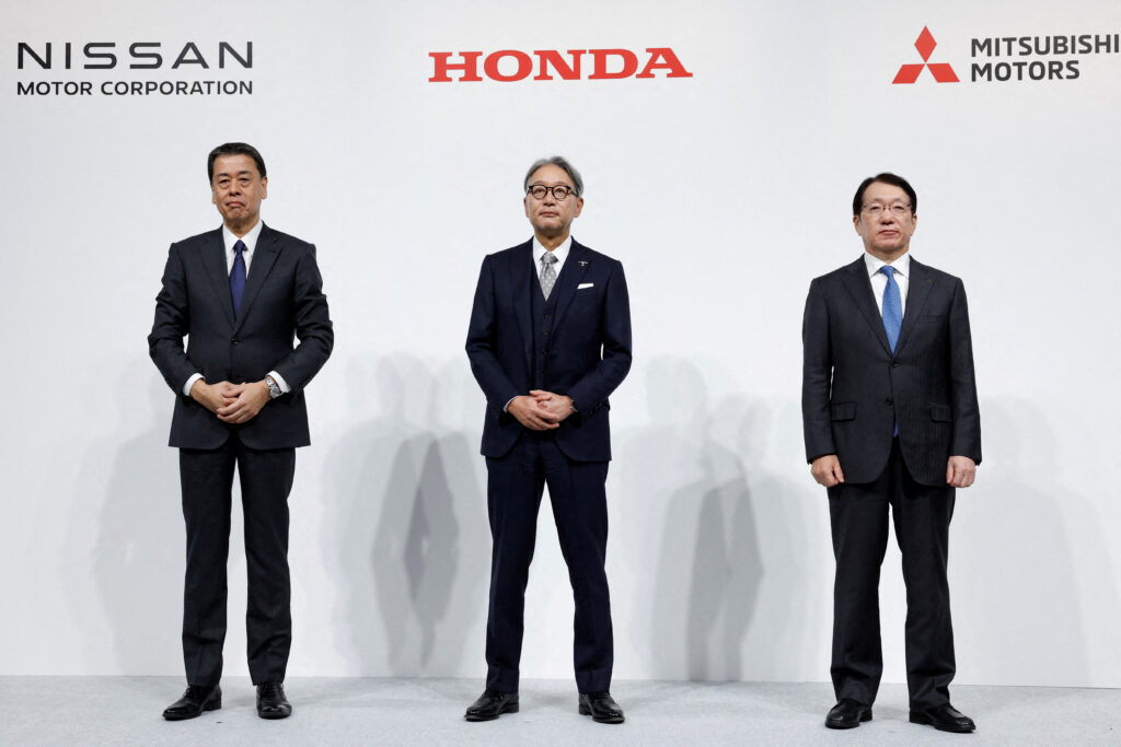 Makoto Uchida, Director, Representative Executive Officer, President and CEO of Nissan Motor Corporation, Toshihiro Mibe, Director, President and Representative Executive Officer of Honda and Takao Kato, Director, Representative Executive Officer, President & CEO of Mitsubishi Motors, pose for a photo following a joint press conference on their merger talks, in Tokyo, Japan, December 23, 2024. (REUTERS)