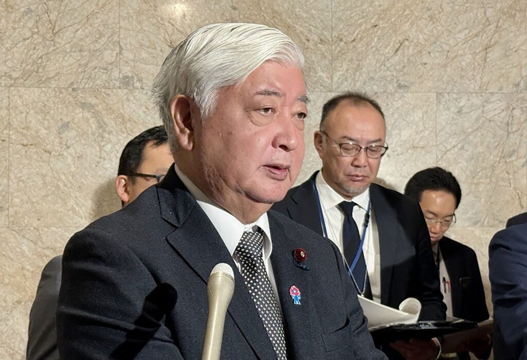 Japanese Defence Minister Gen Nakatani (C) speaks to the media inside the Diet in Tokyo on January 31, 2025. New US Secretary of Defence Pete Hegseth and his Japanese counterpart Gen Nakatani agreed in a phone call on January 31 to continue efforts to strengthen the countries' alliance, Tokyo said. (Photo by JIJI Press / AFP)