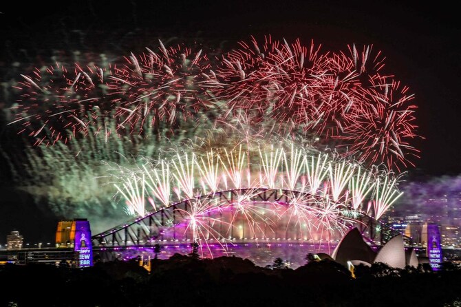 Fireworks light up the midnight sky over Sydney Harbour Bridge and Sydney Opera House during 2025 New Year’s Day celebrations in Sydney. (AFP)