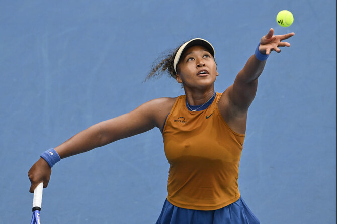 Osaka overcame a swirling breeze and a lengthy rain break to progress comfortably. (AP)