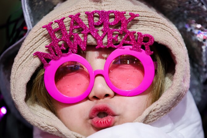 A reveler celebrates New Year's Eve in Times Square on December 31, 2024, in New York City. (AFP)