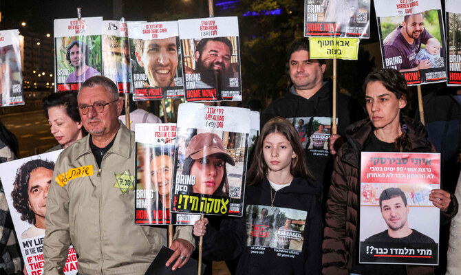 Family members of Liri Albag, an Israeli hostage taken captive by Palestinian militants to the Gaza Strip during the October 7 attacks, demonstrate in Tel Aviv on January 4, 2025, calling for action to secure the release of the Israeli hostages amid the ongoing war in the Palestinian territory between Israel and Hamas. (AFP)