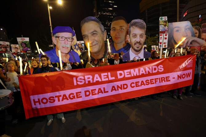 People hold cutouts of images of hostages during a protest against the government and to show support for the hostages who were kidnapped during the deadly October 7, 2023 attack, amid the ongoing conflict in Gaza between Israel and Hamas, in Tel Aviv, Israel January 4, 2025. (REUTERS)