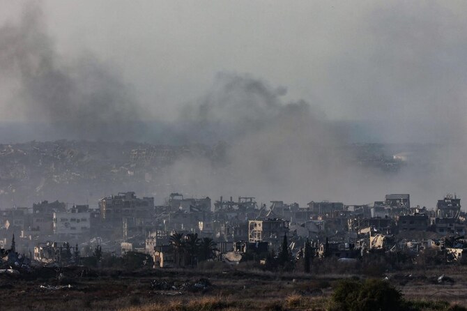 This picture taken from southern Israel shows smoke rising above destroyed buildings in the northern Gaza Strip during Israeli bombardment on January 8, 2025, amid the ongoing war between Israel and the Palestinian militant group Hamas. (AFP)