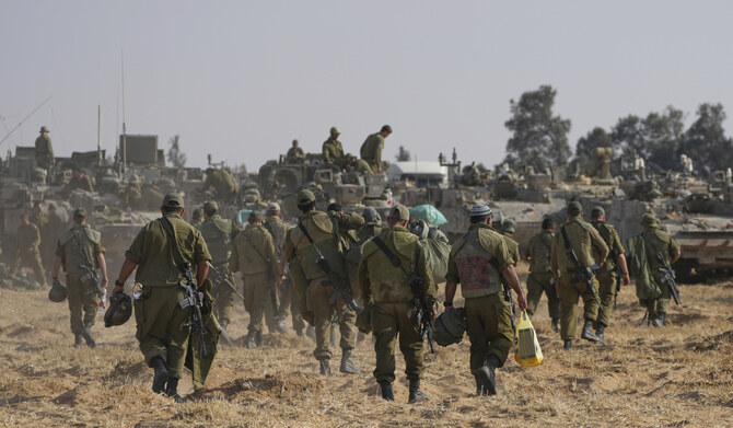 Israeli soldiers are seen at a staging ground near the border with the Gaza Strip, in southern Israel, Tuesday, April 30, 2024. (AP)