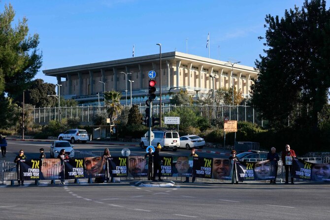 Relatives and supporters of Israelis held hostage in Gaza since October 2023 stage a protest calling for a deal with the Palestinian Hamas group to secure their release, in front of the Israeli parliament in Jerusalem on January 14, 2025. (AFP)