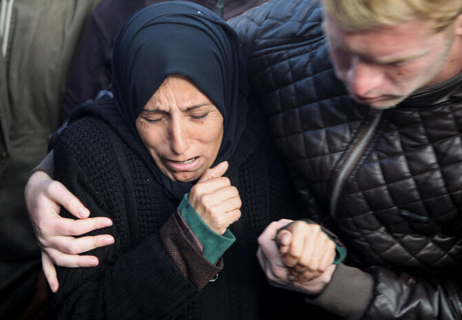 The Israeli offensive in Gaza has killed almost 46,790 Palestinians so far. Above, relatives mourn over the dead at Nasser hospital in Khan Younis on Jan. 17, 2025. (Reuters)