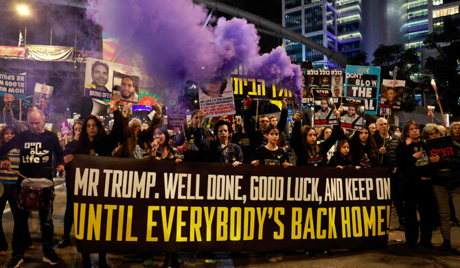 Supporters and relatives of Israeli hostages held captive in the Gaza Strip since the October 7, 2023 attacks by Hamas militants, hold a message addressed to US President Donald Trump during a demonstration in Tel Aviv on January 20, 2025, calling for an immediate end of the war and return of all the hostages. (AFP)