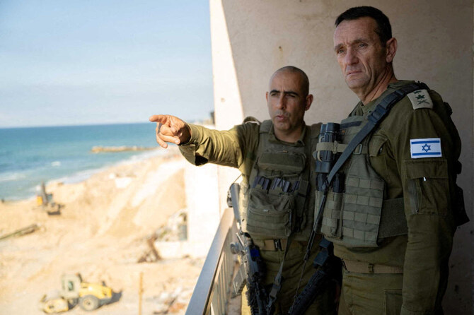 Israeli army Chief of Staff, Herzi Halevi listens to an officer as he visited soldiers during the ongoing ground operation of the Israeli army against Hamas, in a location given as Gaza, in this handout image released in November 2023. (Reuters)