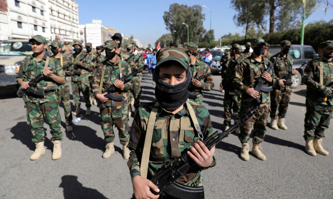 Houthi fighters take part in a parade for people who attended Houthi military training as part of a mobilization campaign, in Sanaa, Yemen December 18, 2024. (Reuters)