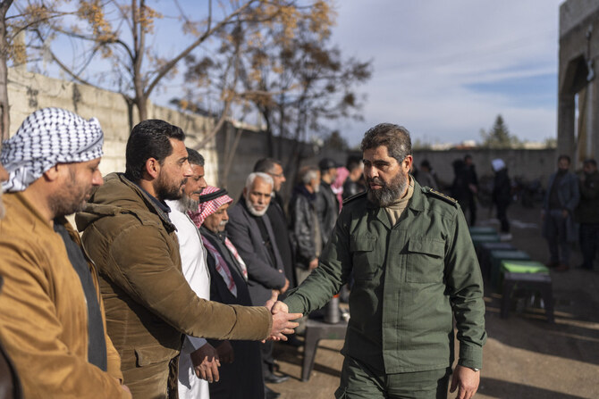 Southern opposition forces commander Ahmad al-Awda meets with local officials, in Nawa, near Daraa, Syria, on Jan. 4, 2025. (AP)