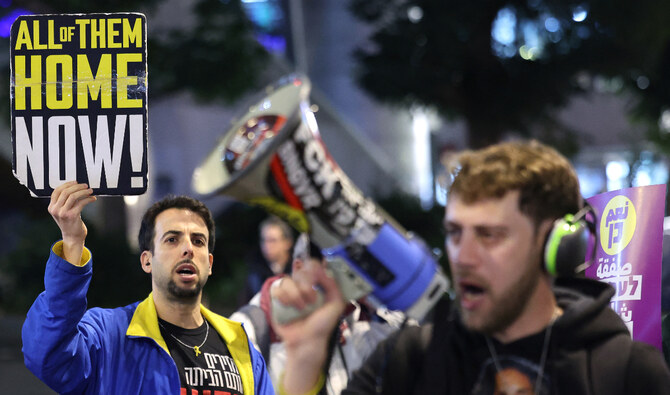 Demonstrators take part in a protest calling for the release of Israeli hostages held in Gaza since the October 7, 2023 attacks, in front of the Israeli Defense Ministry, in Tel Aviv on January 23, 2025. (AFP)