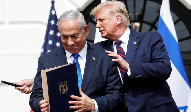 Israel's Prime Minister Benjamin Netanyahu stands with U.S. President Donald Trump after signing the Abraham Accords, normalizing relations between Israel and some of its Middle East neighbors, in a strategic realignment of Middle Eastern countries against Iran, on the South Lawn of the White House in Washington, U.S., September 15, 2020. (REUTERS)