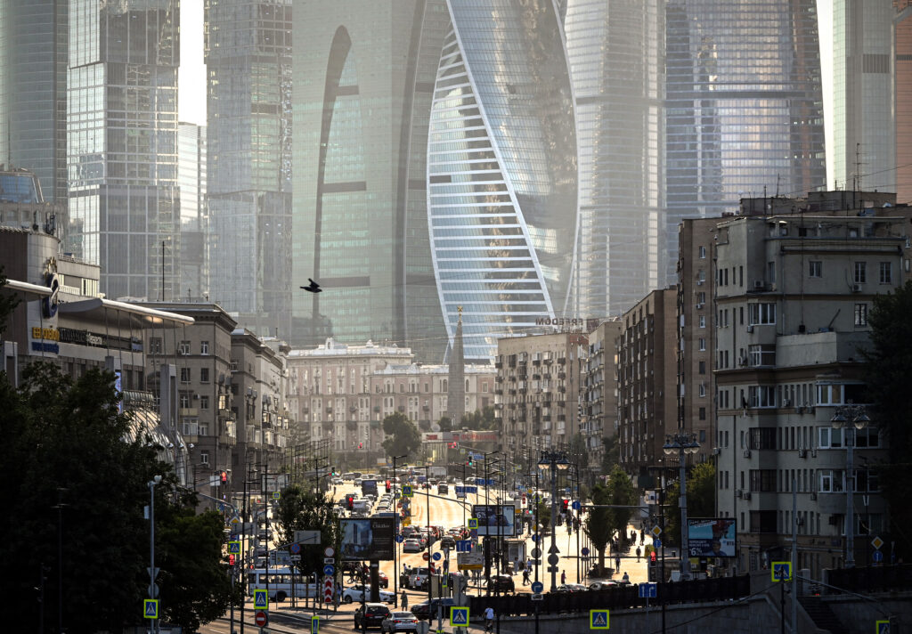 A view shows cars moving along a sunny street in western Moscow in front of Moscow's International Business Centre (Moskva City) skyline Moscow. (AFP)