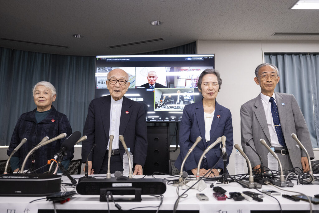 (L-R) Members of the Nihon Hidankyo and atomic bomb suvivors, assistant secretary general Toshiko Hamanaka, co-chair Terumi Tanaka, assistant secretary general Masako Wada and assistant secretary general Jiro Hamasumi pose for photographs during a press conference in Tokyo on October 12, 2024. (AFP)