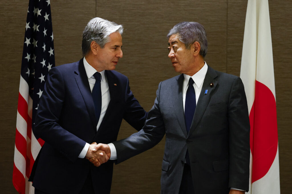 US Secretary of State Antony Blinken (L) shakes hands with Japanese Foreign Minister IWAYA Takeshi during a working lunch at a hotel in Tokyo on January 7, 2025. (AFP)