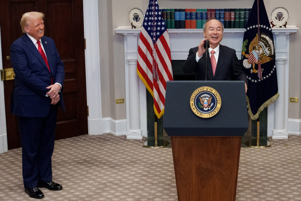 U.S. President Donald Trump and SoftBank CEO Masayoshi Son (R) share a laugh after an aide puts out a step stool for Son as he takes the podium to speak during a news conference in the Roosevelt Room of the White House on January 21, 2025 in Washington, DC. (AFP)