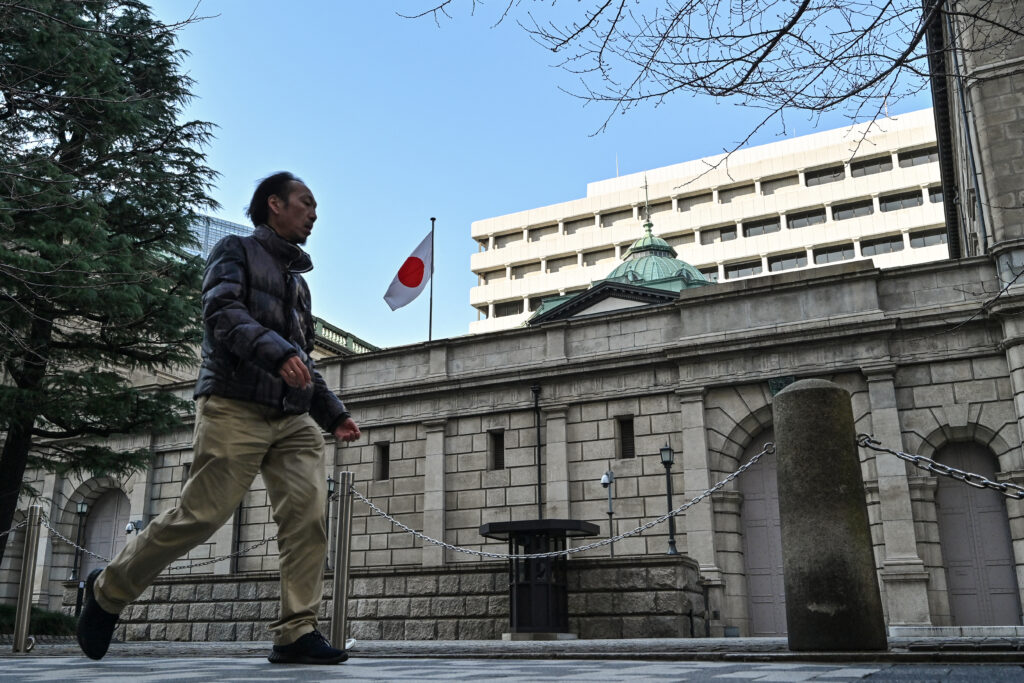 A man walks past the Bank of Japan (BoJ) headquarters complex in central Tokyo on January 23, 2025. (AFP)