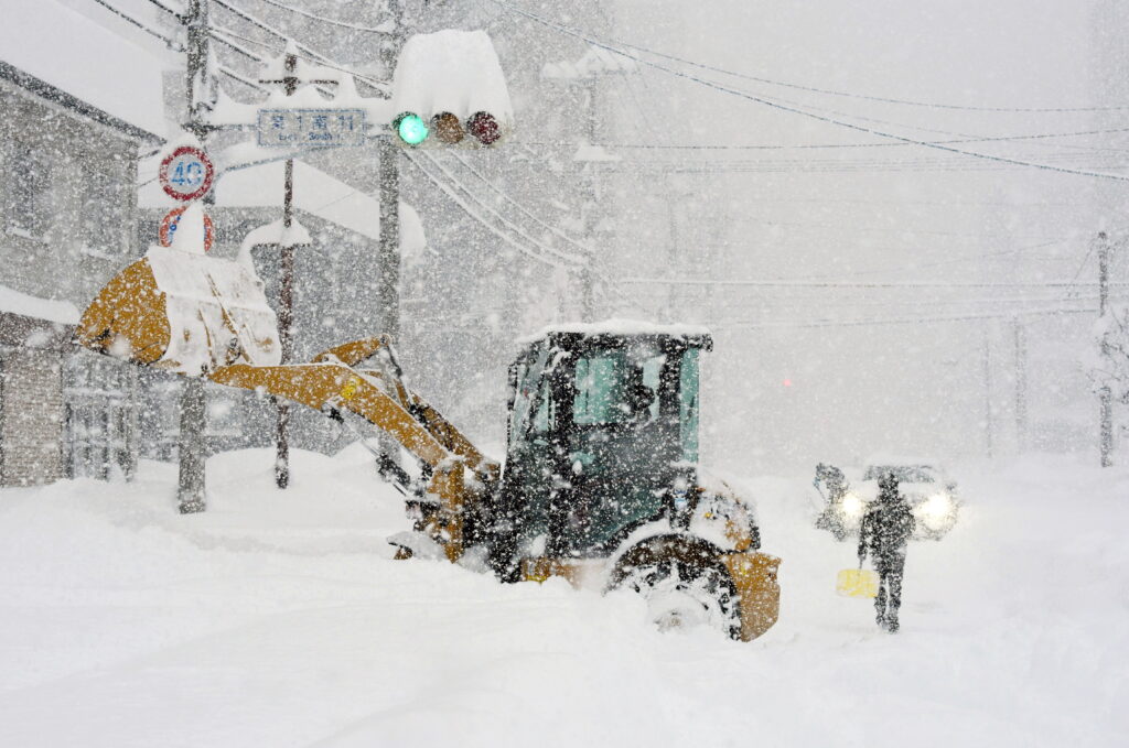 The cold front is expected to continue for several days, and the Japan Meteorological Agency (JMA) has issued warnings about heavy snow and blizzards, which already led to school closures and transportation disruptions. (EPA/JIJI PRESS)