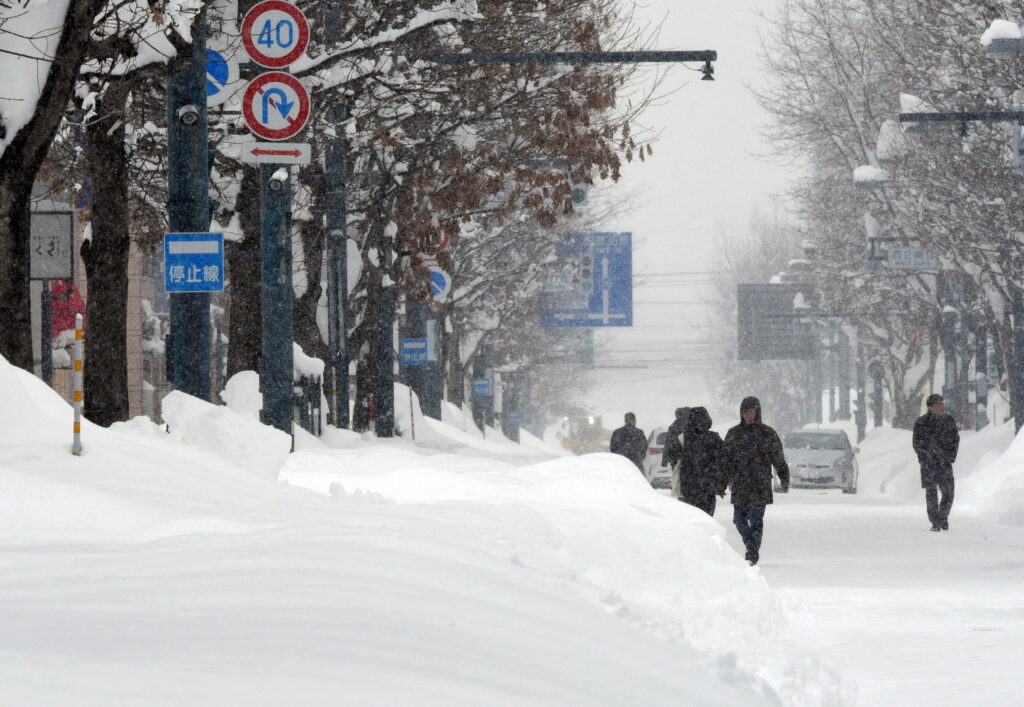 The cold front is expected to continue for several days, and the Japan Meteorological Agency (JMA) has issued warnings about heavy snow and blizzards, which already led to school closures and transportation disruptions. (EPA/JIJI PRESS)