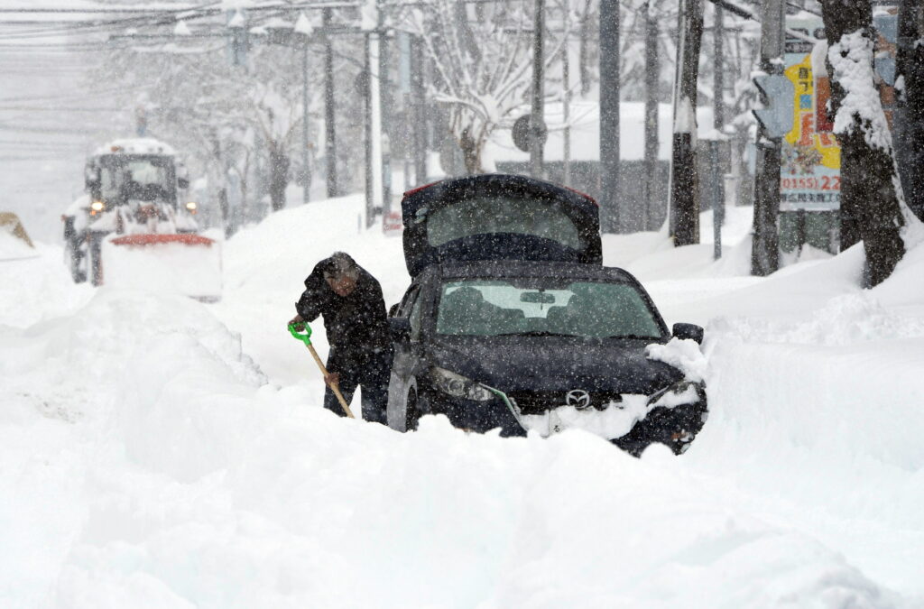 The cold front is expected to continue for several days, and the Japan Meteorological Agency (JMA) has issued warnings about heavy snow and blizzards, which already led to school closures and transportation disruptions. (EPA/JIJI PRESS)