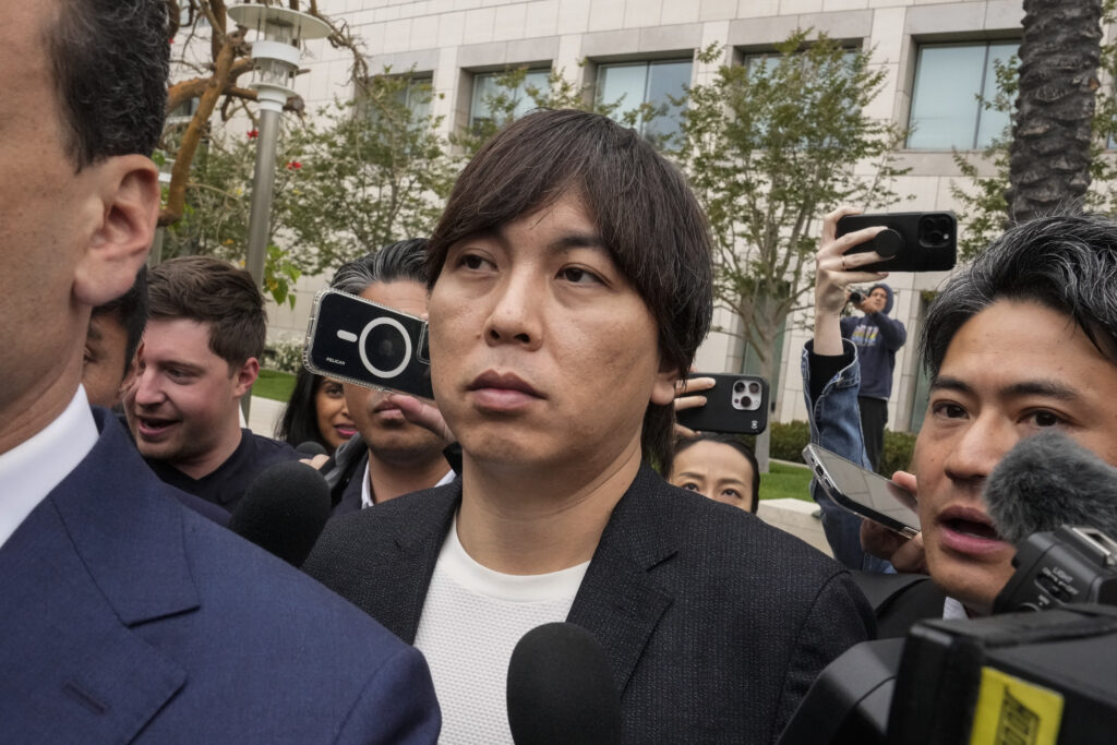 Ippei Mizuhara, center, the former interpreter for the Los Angeles Dodgers baseball player Shohei Ohtani, leaves federal court in Santa Ana, Calif., Tuesday, June 4, 2024, after pleading guilty to bank and tax fraud in a sports betting case. (AP Photo)