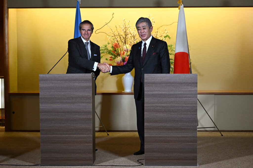 International Atomic Energy Agency (IAEA) Director General Rafael Mariano Grossi shakes hands with Japanese Foreign Minister IWAYA Takeshi (R) during a press conference after a meeting in Tokyo on February 18, 2025. (AFP)