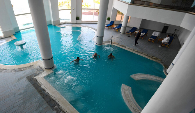 Guests bathe in a thermal pool at a spa in Korbous, in Tunisia's northeastern region of Nabul on January 25, 2025. (AFP)