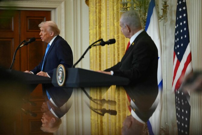 US President Donald Trump and Israel's Prime Minister Benjamin Netanyahu in the East Room of the White House in Washington, DC. (AFP)