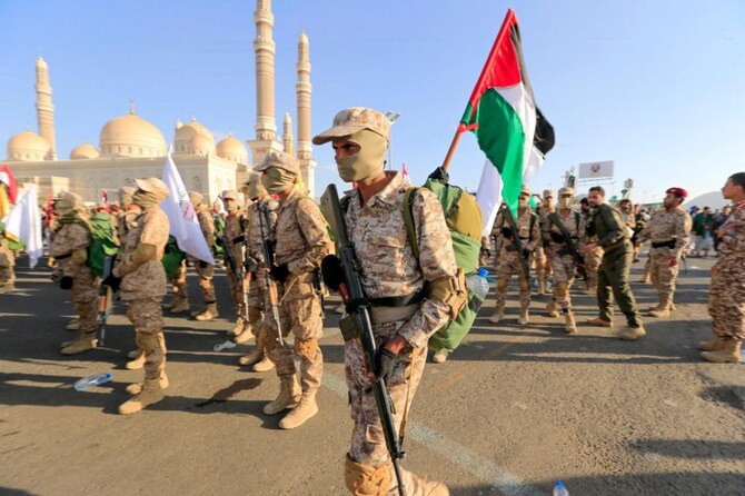 Yemeni fighters march during a rally in solidarity with Gaza in Sanaa. (File/AFP)