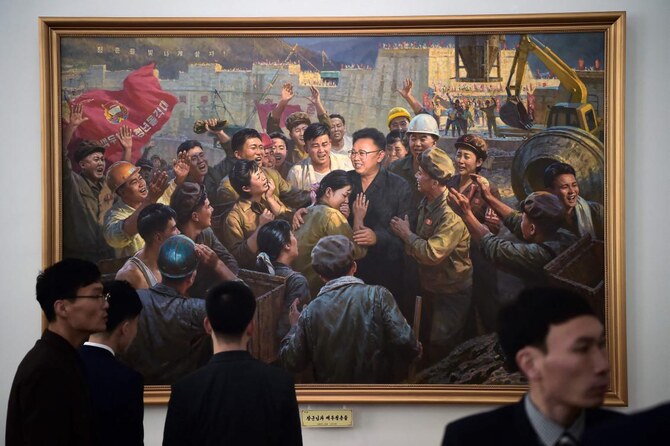 Above, visitors at an art exhibition in celebration of the 83rd birth anniversary of late North Korean leader Kim Jong Il at the Korean Art Gallery in Pyongyang on Feb. 11, 2025. (AFP)