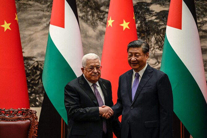 China's President Xi Jinping and Palestinian President Mahmud Abbas during a welcoming ceremony at the Great Hall of the People in Beijing, June, 2023. (AFP)