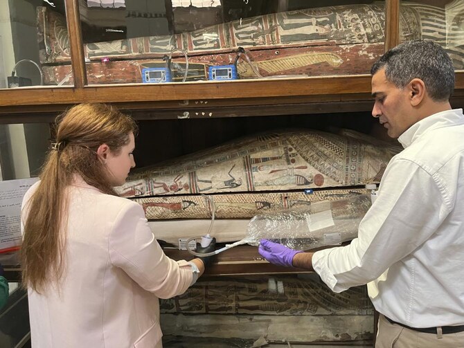 In this undated photo provided by Abdelrazek Elnaggar, Emma Paolin, PhD student at University of Ljubljana, sets up active air sampling with sorbent tubes and pumps. (AP)