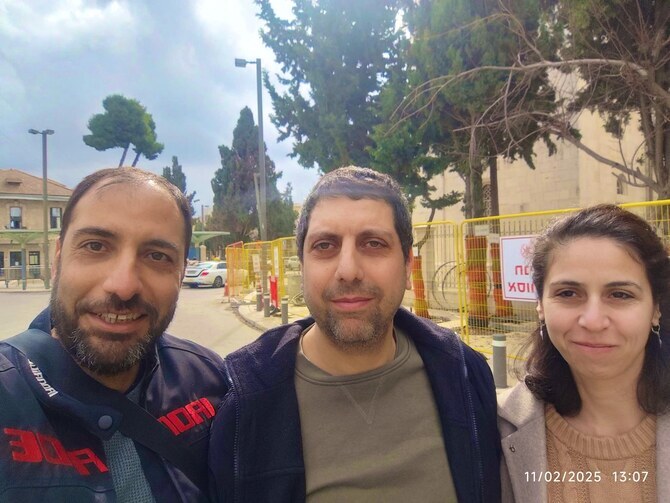 Mahmoud Muna (center) with his wife and cousin after his release from Israeli detention in Jerusalem, Feb. 11, 2025 (Screengrab)