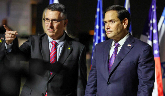 Israel's Foreign Minister Gideon Saar (L) welcomes US Secretary of State Marco Rubio upon arrival at Israel's Ben Guiron Airport in Lod on February 15, 2025 on the first leg of his Middle East trip. (AFP)