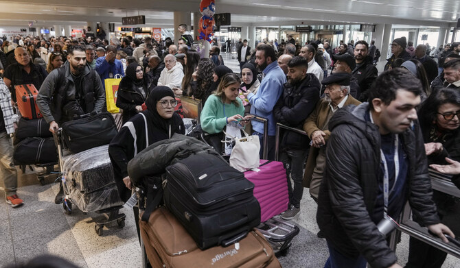 Travelers push their luggage as they arrive at the Rafik Hariri International Airport, in Beirut, Lebanon, Friday, Feb. 21, 2025. (AP)