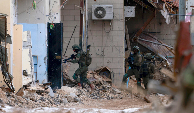 Israeli soldiers take positions in the Jenin camp for Palestinian refugees preventing access to residents in the occupied West Bank on February 24, 2025. (AFP)