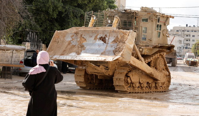 An Israeli military vehicle drives on the street during an Israeli raid, in Jenin in the Israeli-occupied West Bank, February 24 2025. (REUTERS)