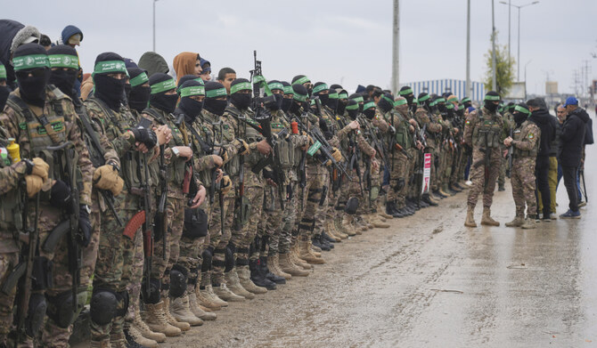 Hamas fighters stand in formation ahead Israeli hostages release in Nuseirat, Gaza Strip, Saturday, Feb. 22, 2025. (AP)