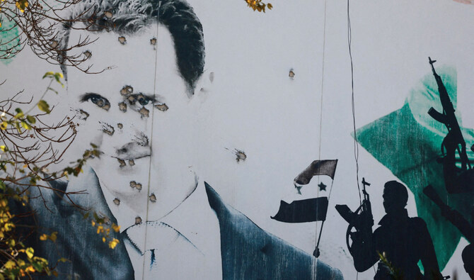 A damaged billboard in Damascus after Assad’s ouster in December. (Reuters)