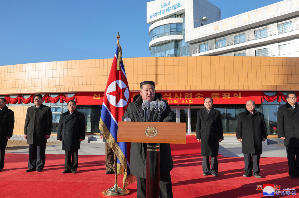 This picture taken on December 28, 2024 and released from North Korea's official Korean Central News Agency (KCNA) via KNS on December 30, 2024 shows North Korea's leader Kim Jong Un (C) speaking at the completion ceremony of the Sinpo City Shallow Sea Aquaculture Plant in South Hamgyong Province. (AFP)