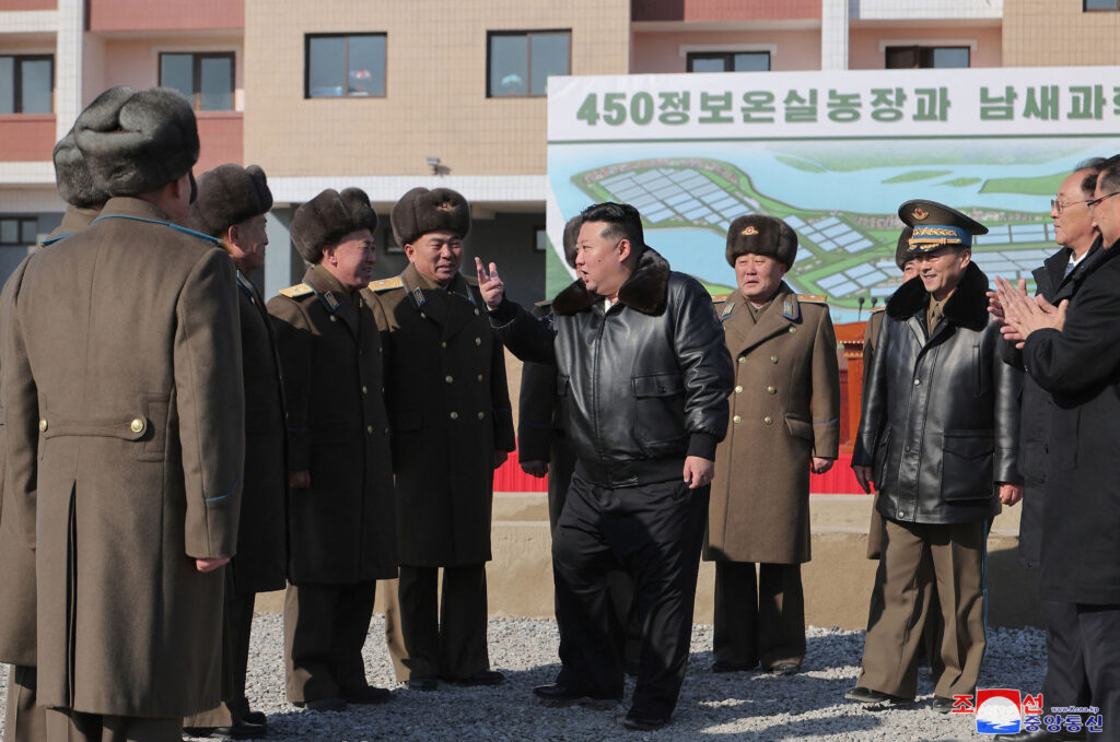 This picture taken on February 10, 2025 and released from North Korea's official Korean Central News Agency (KCNA) on February 11, 2025 shows North Korean leader Kim Jong Un (C) attending the inauguration ceremony of the greenhouse farm and vegetable science research base in North Pyongan province. (AFP)