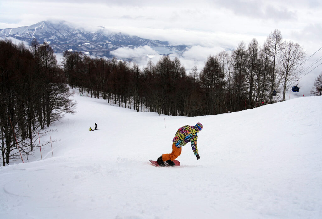 A visitor snowboards at Myoko Suginohara Ski Resort in Myoko, Niigata prefecture, Japan March 5, 2025. (Reuters)
