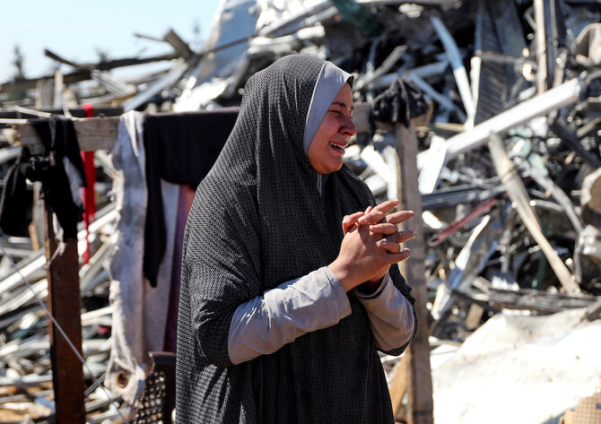 Mourner reacts during the funeral of Palestinians killed in an Israeli strike, in northern Gaza Strip. (Reuters)