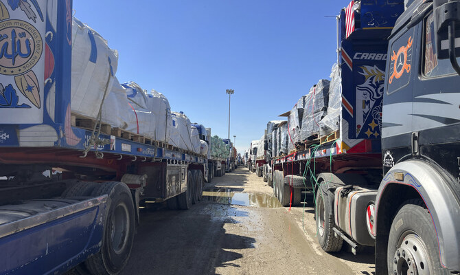 Trucks line up at the Egyptian side of the Rafah border crossing between Egypt and the Gaza Strip after Israel blocked the entry of aid trucks into Gaza, Sunday, March 2, 2025. (AP)