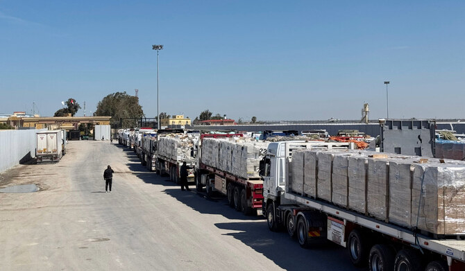 Trucks carrying humanitarian aid line up on the Egyptian side of the Rafah border crossing with the Gaza Strip on March 2, 2025, after Israel suspended the entry of supplies into the Palestinian enclave. (AFP)