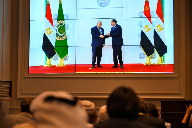 Egypt’s President Abdel Fattah El-Sisi (R) welcomes Palestinian President Mahmud Abbas ahead of an Arab League summit on Gaza on March 4, 2025. (AFP)